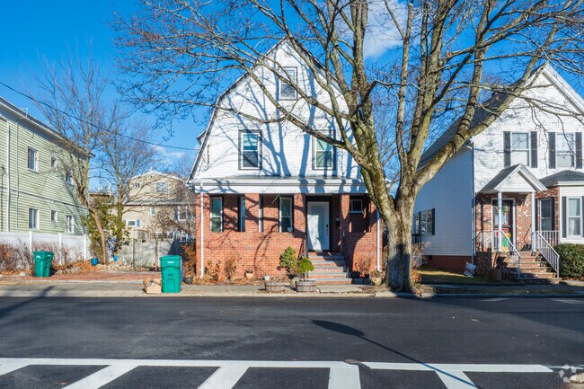 Some homes in Chatham Street are accompanied by large trees in front or behind homes.