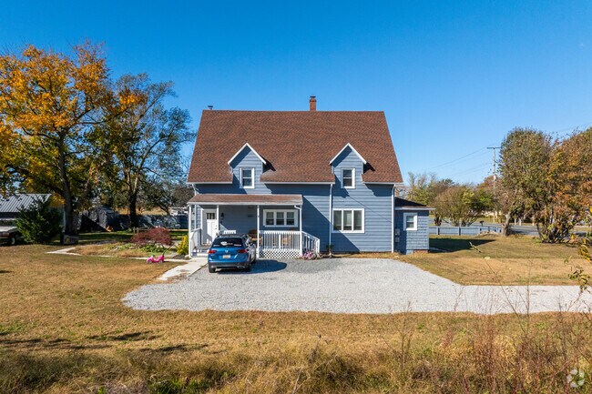 Rustic single-family homes are surrounded by farmland in Rhodesdale.