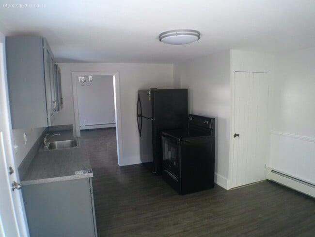 Kitchen with Large walk-in pantry with shelving. Storage available in basement.