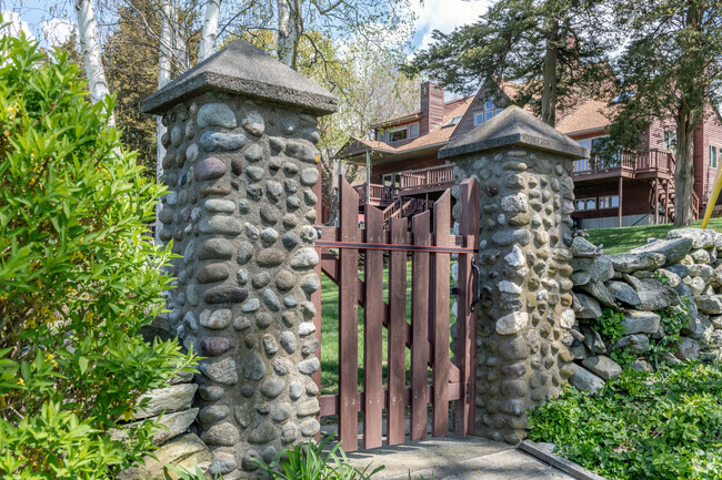 An antique stone gate in the Touisset Highlands neighborhood separates distinctive homes.