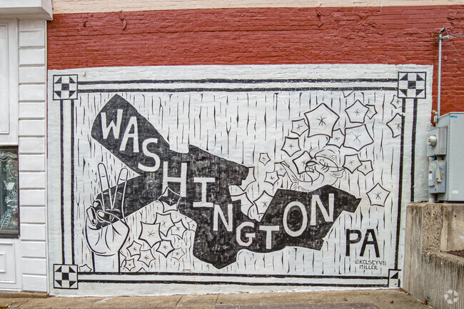 A mural by KelsyVBMiler shows the outline of the neighborhood known as Washington.