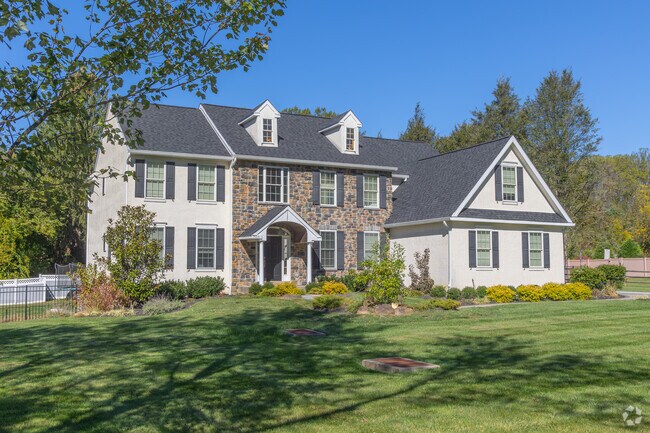 Spacious green lots frame Colonial Revival homes in East Goshen’s quiet neighborhoods.