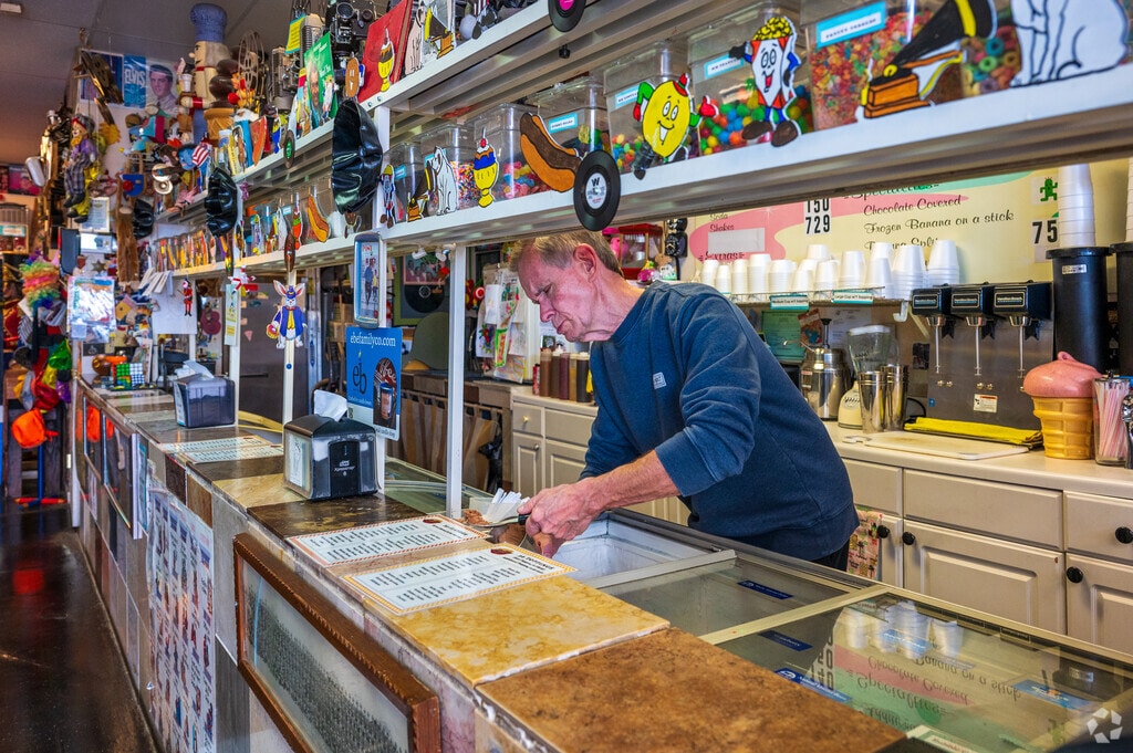 The owner of I Scream Ice Cream prepares to make a delicious malt for an eager customer in Altura.