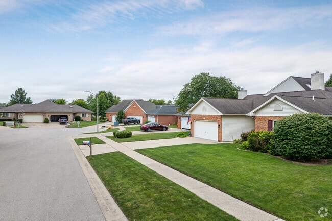 Koke Mill homes sit on tidy lawns and quiet streets.