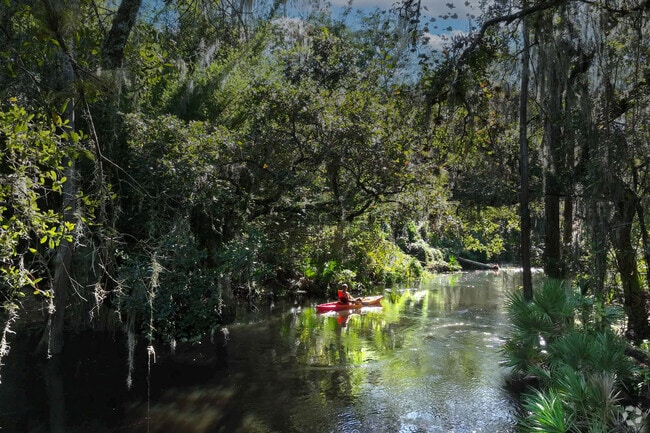 A man paddling on Shingle Creek near the Columbia community.