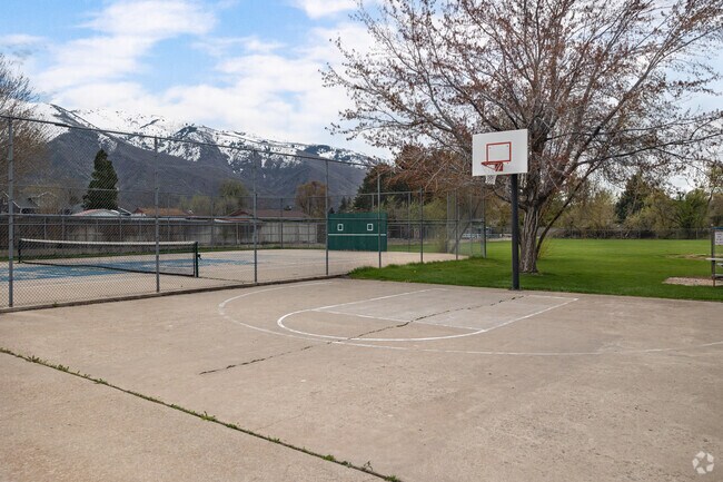 Uintah City Park has a basketball court and tennis court with mountain views.