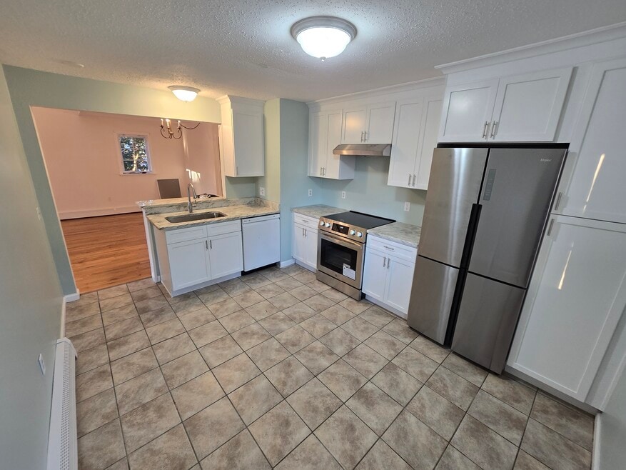 New range, new cabinets, new sink, new countertops