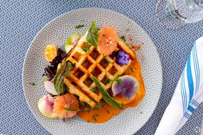 The Salmon Waffle is one of Belgia Cafe's most popular menu items in Capitol Hill.