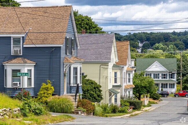 A colorful row of New England and Colonial Revival styled homes in the Broad Hill neighborhood.