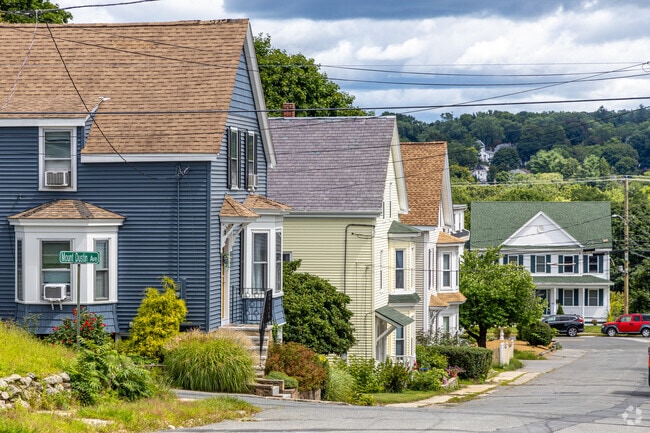 A colorful row of New England-style homes line the streets in the Broad Hill neighborhood.