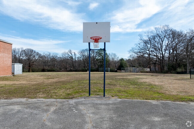 You will find an outdoor basketball court at Memphis Junior Academy.