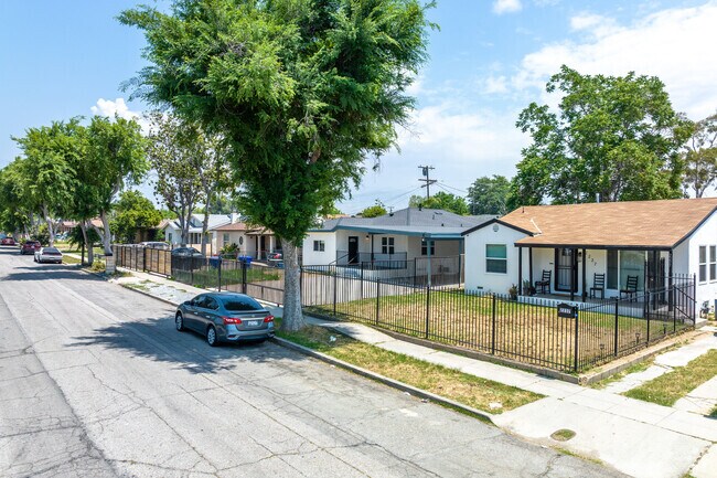 A charming row of traditional single-family homes in Wilson epitomizes timeless elegance.