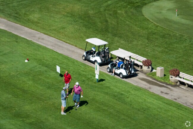 Friends gather on the greens for an afternoon game at the Sycamore Golf Club.