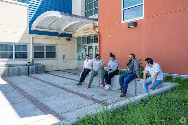 Richmond parents wait for their children outside Coronado Elementary School.