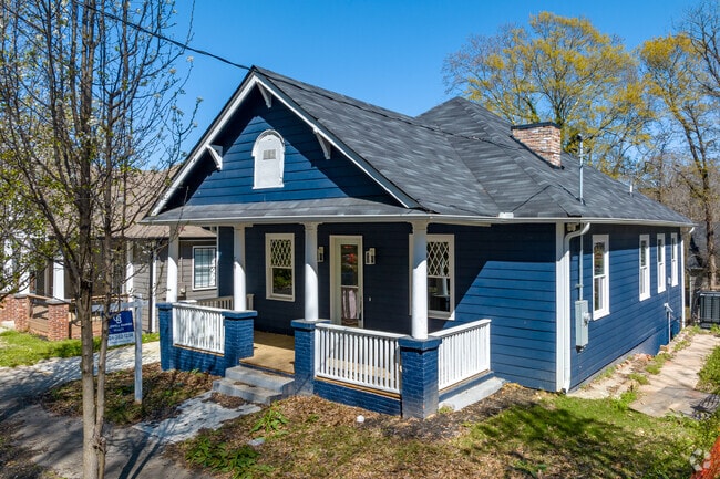Homes in the West End range from red brick to deep navy blue.