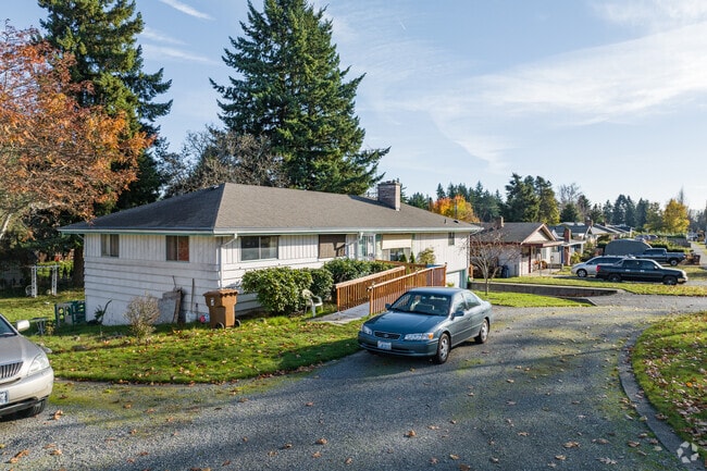 Shallow front lawns and few to no sidewalks are common in West End, Tacoma.