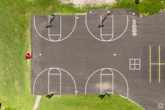 Russell Elementary School has a large play area behind the building.