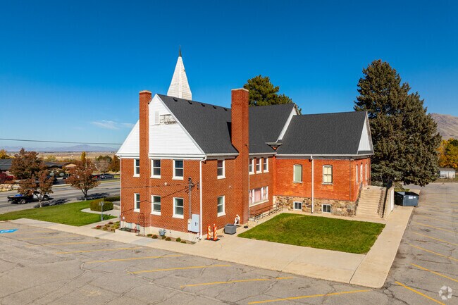 Rear view of Perry’s Heritage Theatre with marshlands stretching beyond Highway 89.