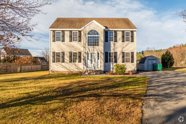 A colonial revival style home in Cleghorn has a large front yard with a driveway.