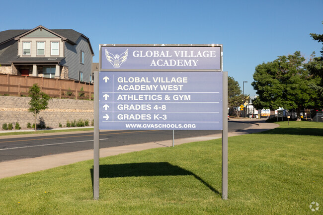 Global Village Academy directions sign.