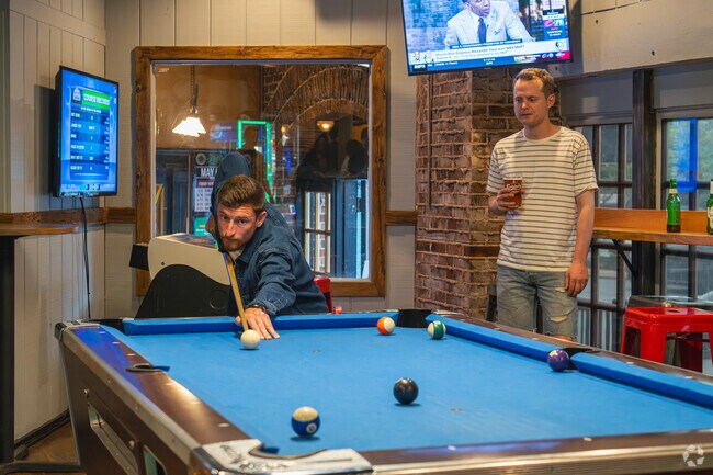 Join friends for a game of pool at Trolley Tap House in Delaware Avenue.