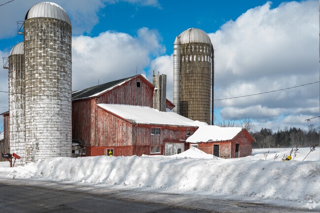Traditional red barns dot the countryside of Mina.