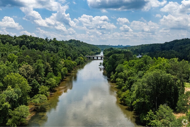 The Chattahoochee River carves through North Riverside, offering peaceful waterfront views and enhancing the neighborhood’s natural charm.