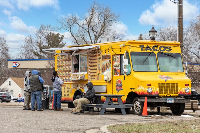 Grab a taco at the El Senior De Los Tacos food truck parked in Lions Park.