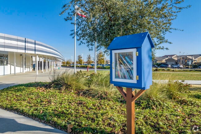 Spring Lake Elementary School has Little Free Library outside the parking lot.