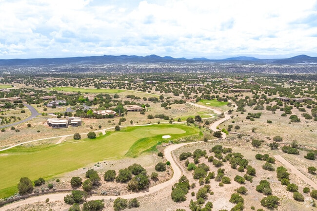 The Sangre de Cristo Mountains sit on the horizon of the Las Campanas homes and golf course.