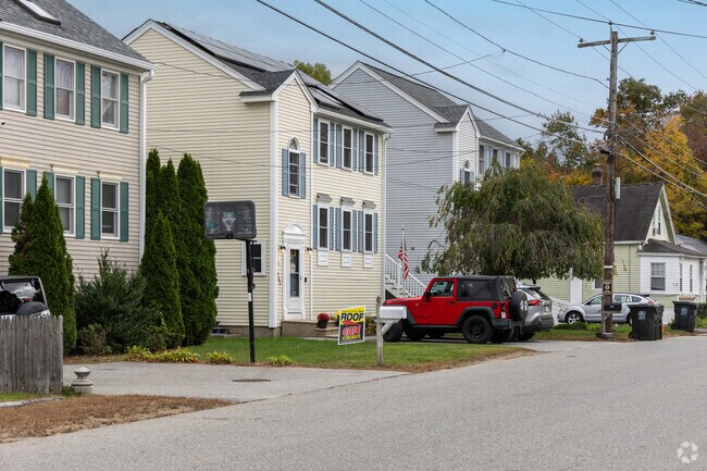 A row of homes showcasing the wide variety of home styles that you can find in Dracut.