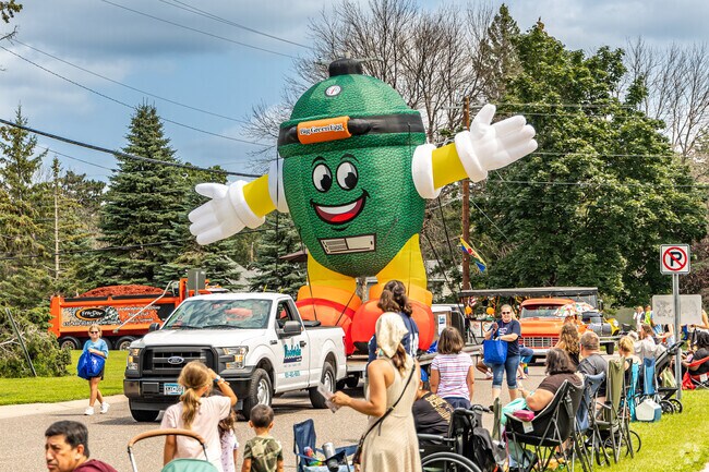 Local businesses participate in the Canadian Days Parade in Little Canada every August.