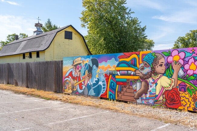 Many colorful murals line the wall along the bike trail in downtown East Dundee.