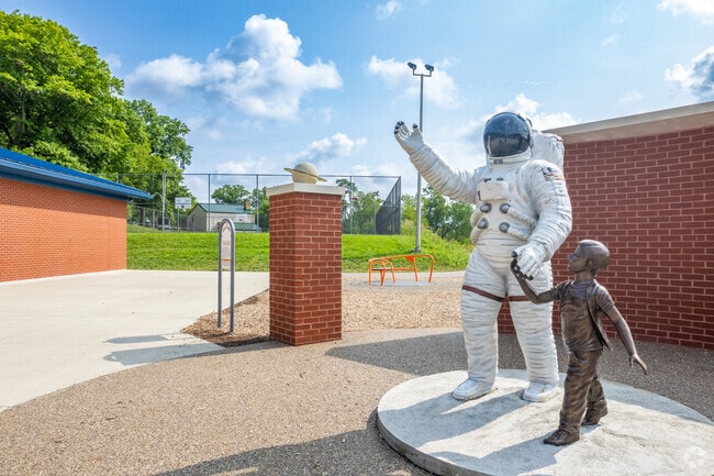 An astronaut statue welcomes Carnot-Moon locals to Moon Park.