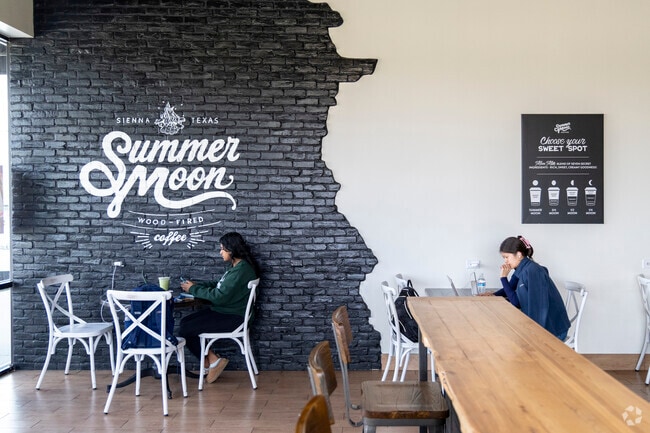 Students focus intently while studying at Summer Moon Coffee in Teal Run.