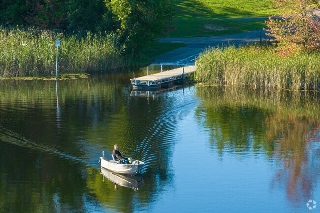 A fisherman makes his way out onto Buell Lake.