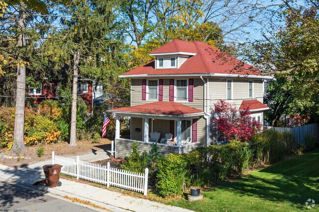 A lovely American Foursquare home sits in the sun in the Turner-Dodge neighborhood.