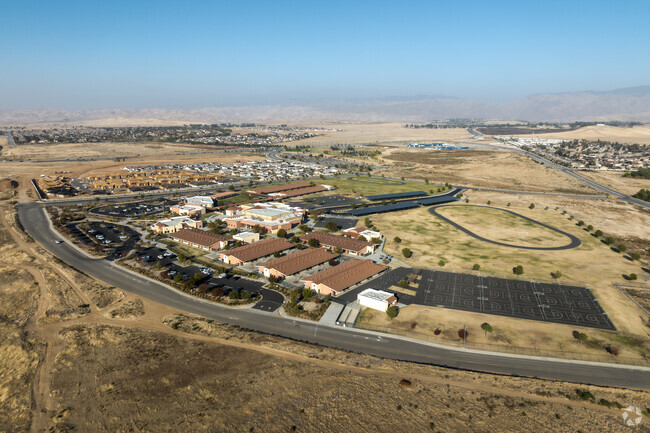 Paul L Cato Middle school has numerous basketball courts overlooking the track field.