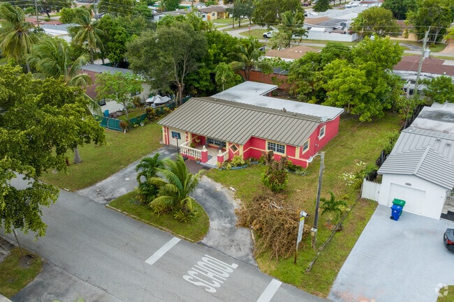 Capturing a stunning red painted bungalow in Miramar Tropical from above.