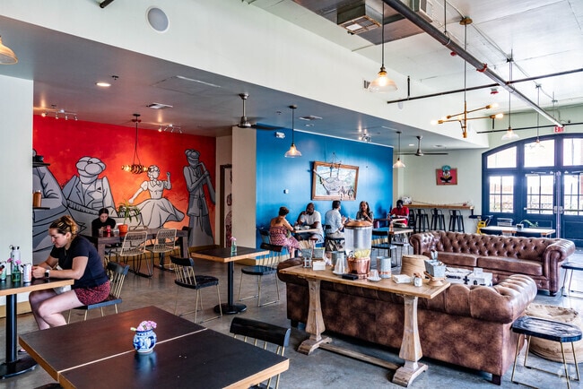 People enjoying their food and coffee inside Backatown Coffee in the Iberville neighborhood.