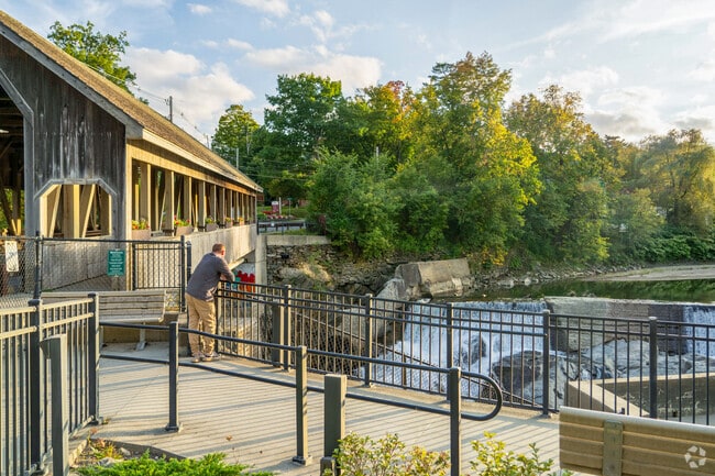 Hartford residents take in scenic views of Mill Pond Falls at Quechee Lakes.