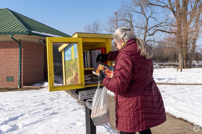 Stop at the little library in Fairbanks Park and drop off some new books for visitors.