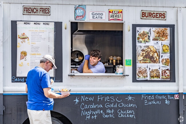 Residents enjoy fresh fries and burgers from food trucks in Muse Pennsylvania.