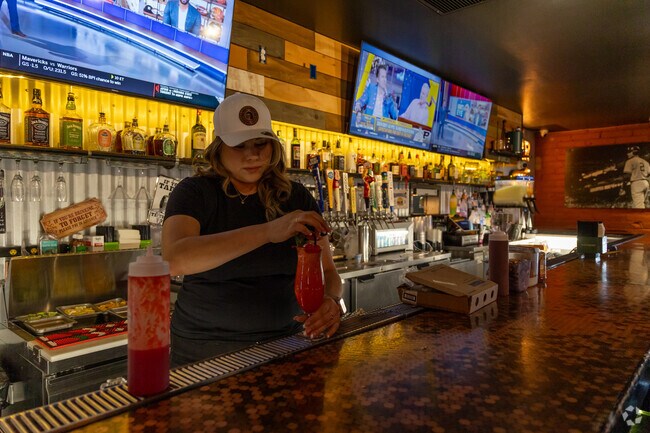 The Neighborhood serves up unique cocktails and wing specials, near Naylor.
