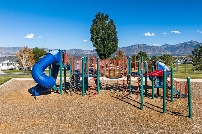 Woodchips provide a soft landing at this playground at Oquirrh Highlands Park.
