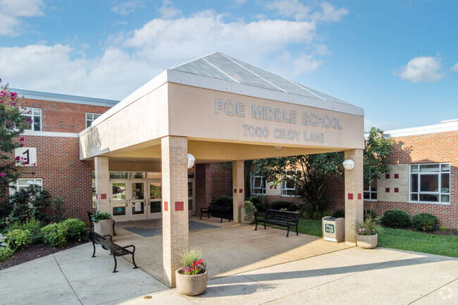 Multiple seating benches are available at the front entrance of Poe Middle School in Annandale.