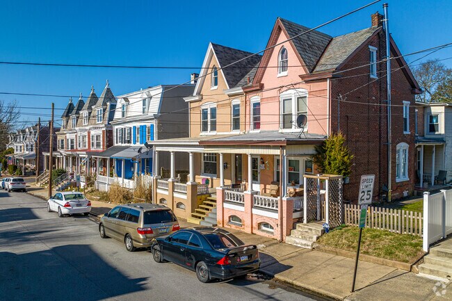 Attached row homes in Beech-Wilson feature covered front porches for summer shade.