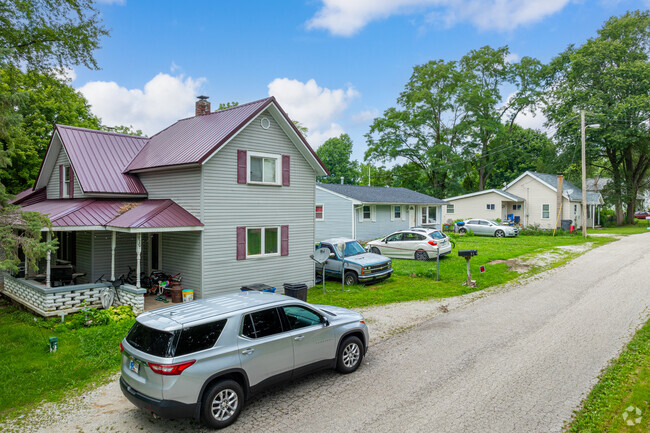 Many Colburn homes don't have garages, so cars park wherever there's room.