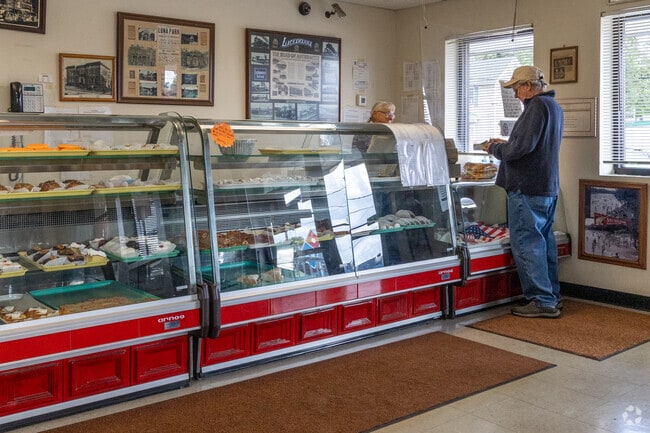 Buying some fresh baked bread at National Pastry Bake Shop in Tripp's Park.