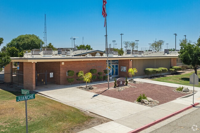 An American flag waves high above the entrance to Tranquillity High School.